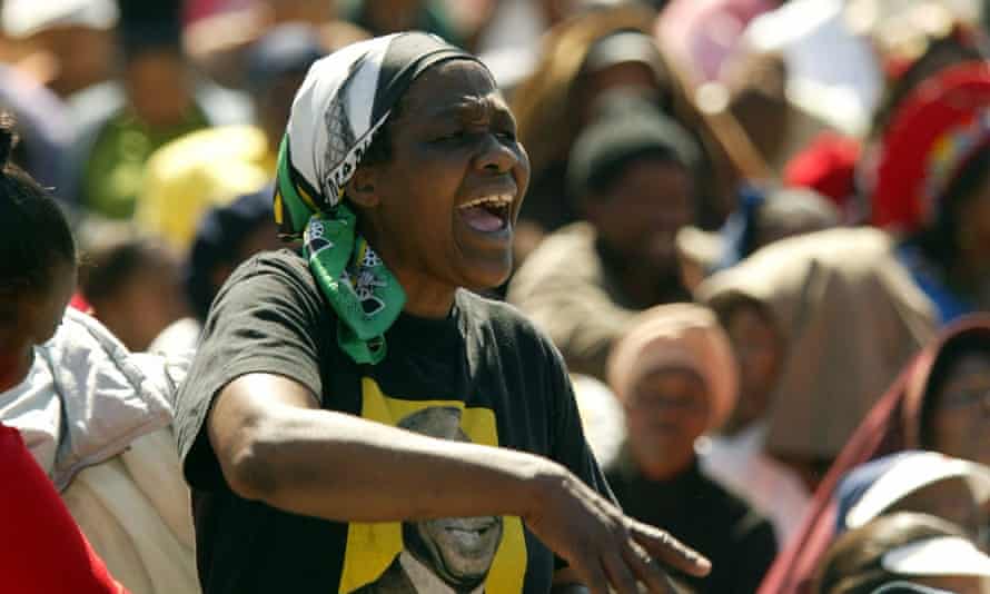 At the 50th anniversary of the original march, a woman is seen wearing an ANC T-shirt in Pretoria, South Africa.