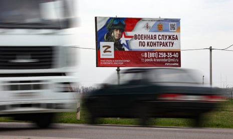 A billboard advertising ‘Contract military service’ is seen beside a highway outside Krasnodar, Russia.