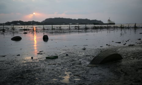 Tyres float in polluted waters along the edge of Guanabara Bay, the Olympic sailing venue in Rio de Janeiro state