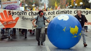 Protesters take part in the ‘Climate March’, one of many demonstrations during the conference