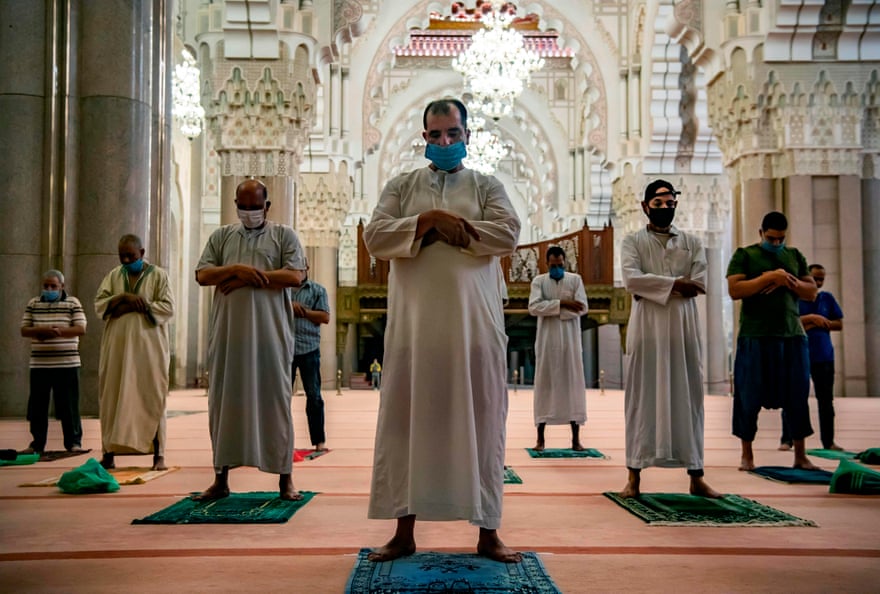 Muslim worshippers in Casablanca, Morocco, follow Covid restrictions during prayers at the Hasan II mosque, one of the largest in Africa.