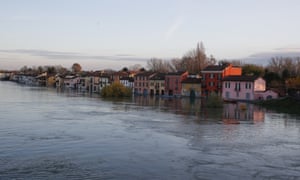 Water reaches the houses after the Ticino River overflowed its banks in Pavia, Italy.