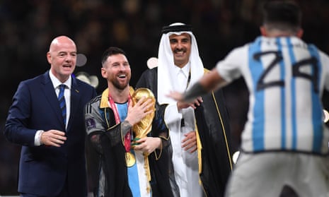 ‘Paraded like a beaming Guy Fawkes dummy’: Lionel Messi with Gianni Infantino and the Emir of Qatar, Sheikh Tamim bin Hamad Al Thani.