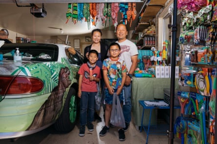 a family visiting the dinosaur-themed funhouse pose for a picture