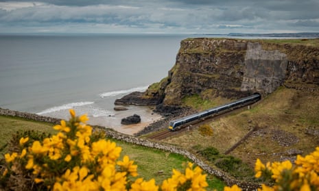 The Belfast-Derry train crosses Downhill beach near Coleraine.