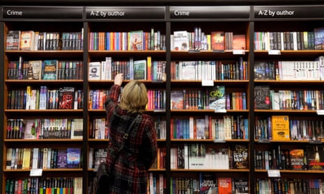 A woman browsing crime fiction books in Waterstones, Cambridge.
