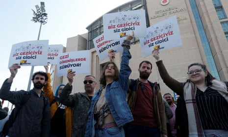 Supporters of the Gezi movement stand outside the courthouse as Osman Kavala and seven others were sentenced.