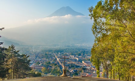 Cerro de la Cruz, Antigua Guatemala. At the north of Antigua is Cerro de la Cruz, there is a large cross constructed on a hillside overlooking Antigua. From this giant stone cross there are sweeping views south over the city with Agua Volcano in the background.