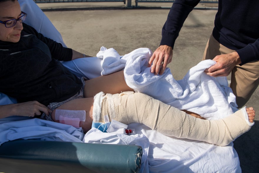 Mark Rapley unwraps the blanket around Chantelle Doyle’s injured leg
