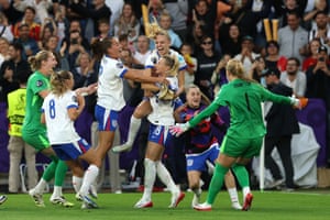 England’s women footballers jump and hug to celebrate their Euro 2025 win