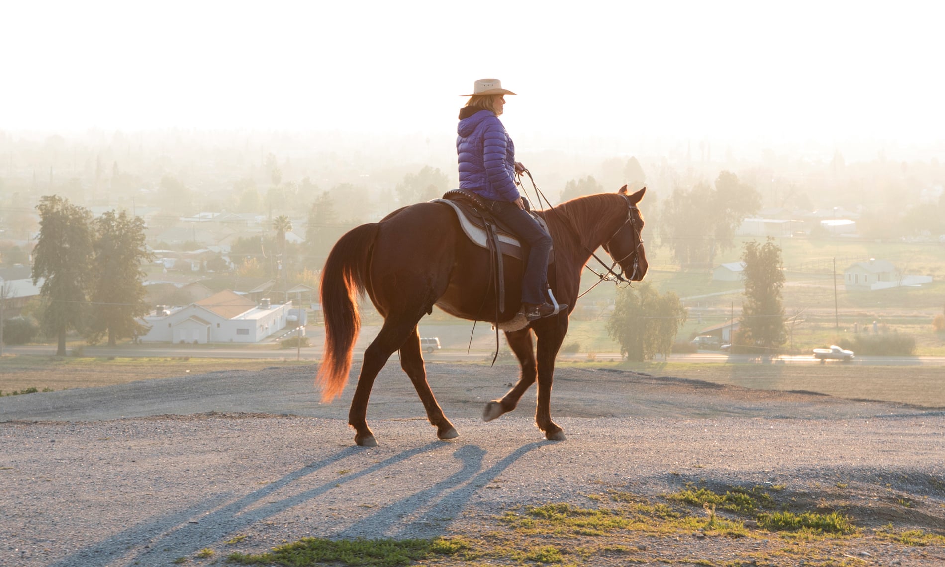 A horse rider desends into the haze in Porterville –one of the most poluted cities in the US. 