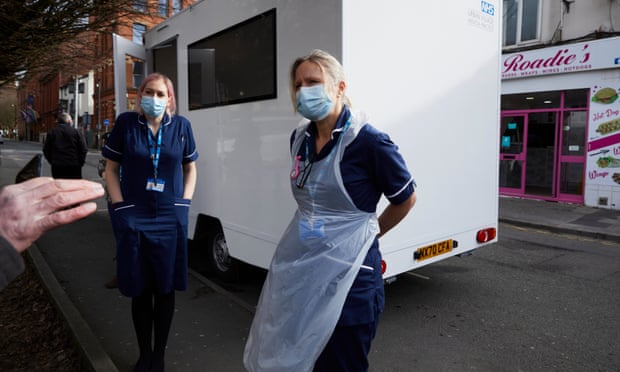 Homeless healthcare specialist nurses Helen Gee (left) and Liz Thomas giving Covid-19 vaccines to homeless people at their mobile clinic in Manchester.