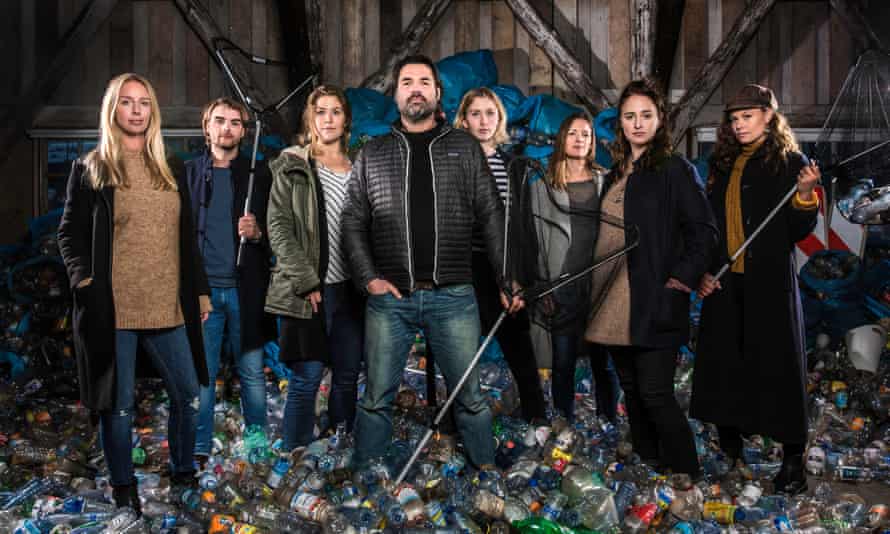 Marius Smit, centre, in a publicity image for Plastic Whale. He is surrounded by volunteers.