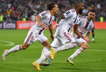 Alexandre Lacazette celebrates after scoring for Lyon against Montpellier.