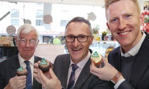 Greens candidate for Kooyong Julian Burnside, Richard Di Natale and the candidate for Higgins Jason Ball in Malvern, Melbourne on Thursday