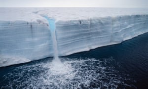 Melting glacier. The surface warms up and and streams of water runs to the edge.