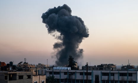 Smoke rises over buildings after an Israeli strike in Rafah, southern Gaza, on Thursday