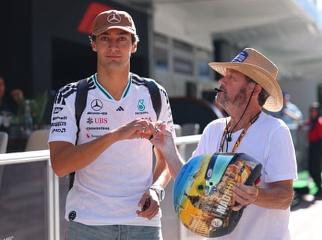 George Russell signs an autograph for a fan at the United States Grand Prix