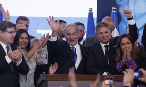 Benjamin Netanyahu, centre, waves to supporters at the Likud party’s headquarters in Jerusalem in November.