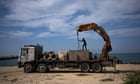US troops begin construction of Gaza aid pier as questions remain over distribution