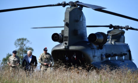 Boris Johnson arriving in a chinook helicopter to visit military personnel on Salisbury plain training area today.