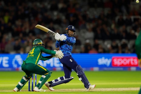 Jofra Archer of England hits a boundary.
