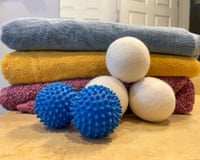 Two different types of dryer balls in front of folded towels