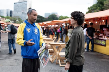 Michel Vasconcelos selling copies of Boca de Rua in the market in Porto Alegre