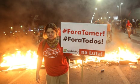 A protester in Brasilia. The banner reads ‘Out Temer! Out everyone!’
