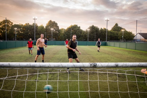 Goal! Chris Godfrey (centre) playing five-a-side football in north London.