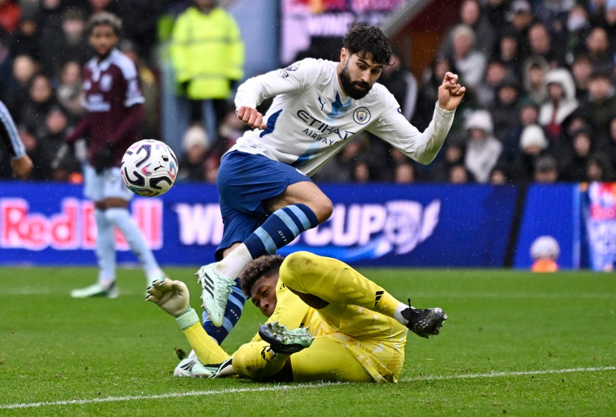 Zion Suzuki comes out to stop Josko Gvardiol during Aston Villa's win over Manchester City