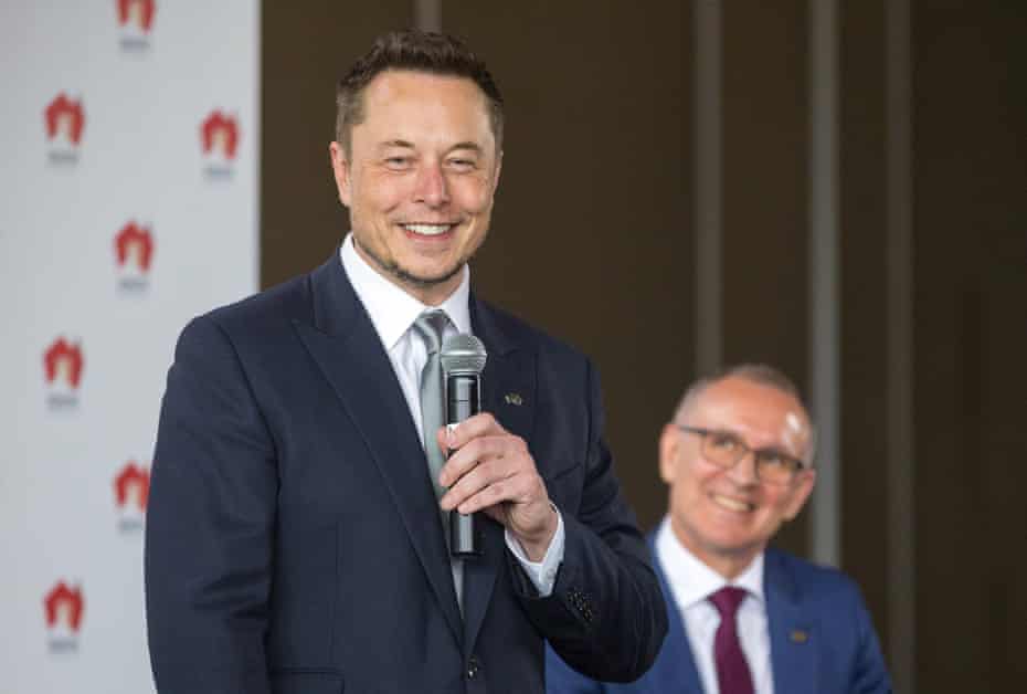 South Australian Premier Weatherill listens to Tesla Chief Executive Officer Musk speaking during an official ceremony in Adelaide