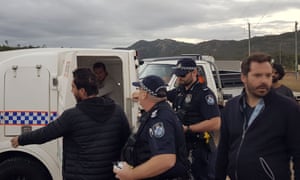 French journalists arrested covering an anti-Adani protest have been ordered by police not to go within 20km of the Carmichael mine site