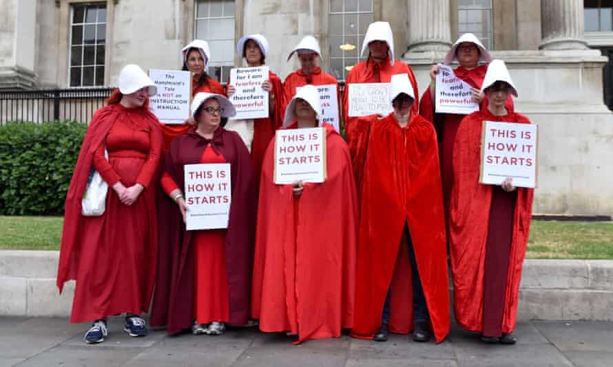 Protesters dressed as handmaids in London on Tuesday