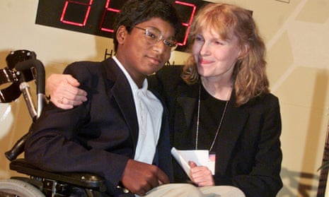 Mia Farrow poses with her adopted son Thaddeus in 2000 as they participate in the global summit on polio eradication at United Nations headquarters.