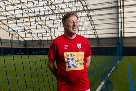 Simon Forrest in a red top in a net