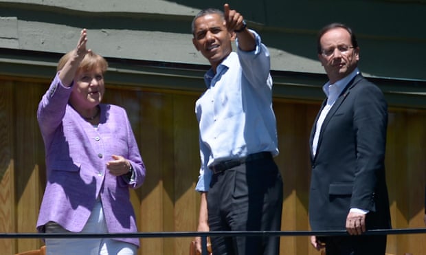German Chancellor Angela Merkel , US President Barack Obama and French President Francois Hollande chat after they posed for a family photo during the G8 summit, May 2012 at the Camp David