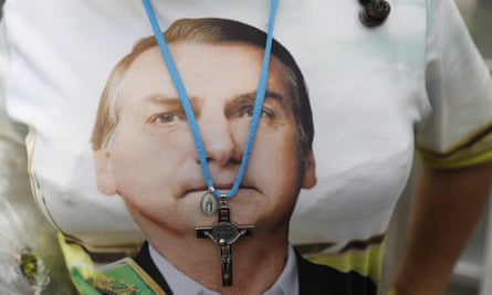 A supporter of Brazil’s president elect Jair Bolsonaro wears a T-shirt with his likeness.