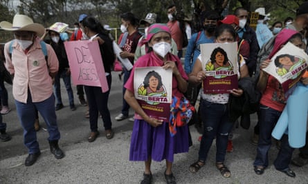 Activists and supporters of Berta Cáceres stand outside the Honduran supreme court. The trial began five years after her murder.