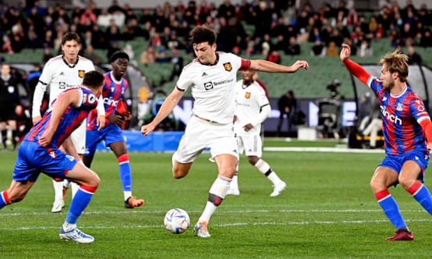 Manchester United captain Harry Maguire has a shot on goal against Crystal Palace.