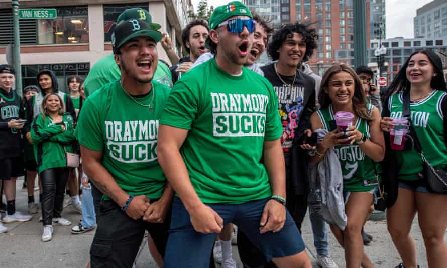 Boston Celtics fans wait in line to enter Fenway Park for a watch party as the Boston Celtics take on the Golden State Warriors