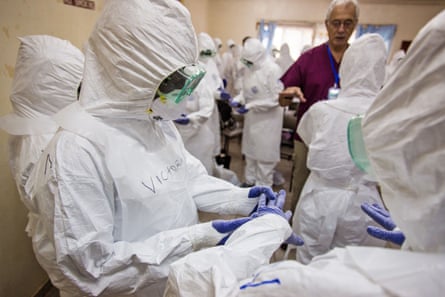 Nurses in Sierra Leone receiving Ebola PPE training from a WHO medic in 2014.
