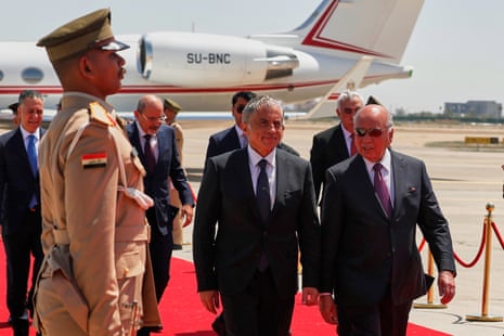 Iraqi foreign minister Fuad Hussein, right, walks with Jordanian prime minister Jafar Hassan, centre, upon his arrival at Baghdad international airport for the Arab League summit.