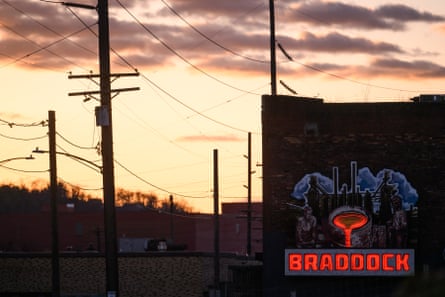 A billboard against a the sky at sunset