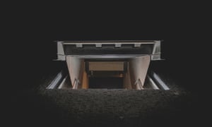 At night, the entrance to the Amsterdam club Shelter is viewed; in the image steps lead down to the club.