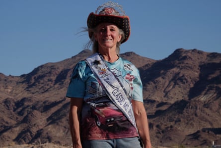 Woman stands in front of mountain