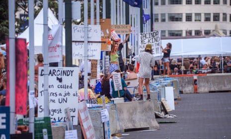 People protest against Covid public health measures outside parliament in New Zealand.