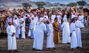 ‘Old friends meet during the ardha annual camel race near Bidiya in north-eastern Oman. Hundreds of local breeders gather before dawn and run the camels side by side down a straight sand track. Everyone is looking their best, a testament to the value Omanis place on cultural heritage.’