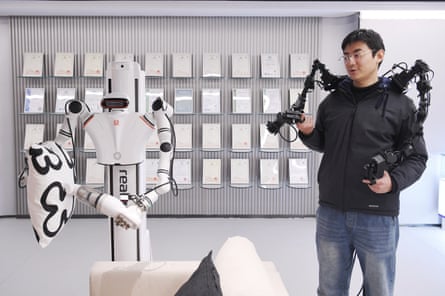 An engineer trains a humanoid robot at the humanoid robot innovation center at Shougang Park on March 28, 2025 in Beijing, China.