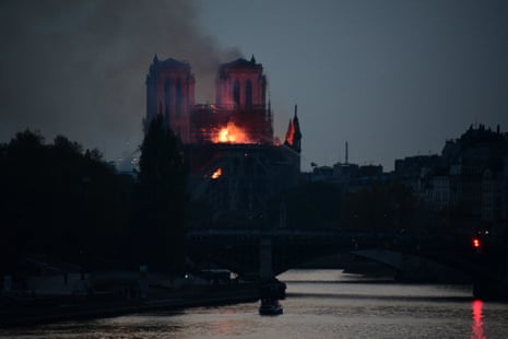 Flames rise from Notre Dame cathedral as it burns in Paris.
